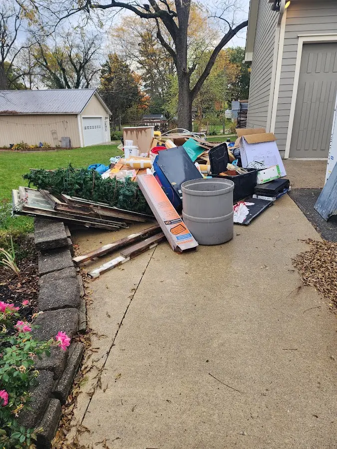 Dumpster being loaded with debris for 30 Yard Dumpster Rental in Corpus Christi